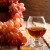 big_Firefly-Cognac-or-Brandy-in-a-glass-and-fresh-grapes-still-life-in-rustic-style-vintage-wooden-bac.jpg